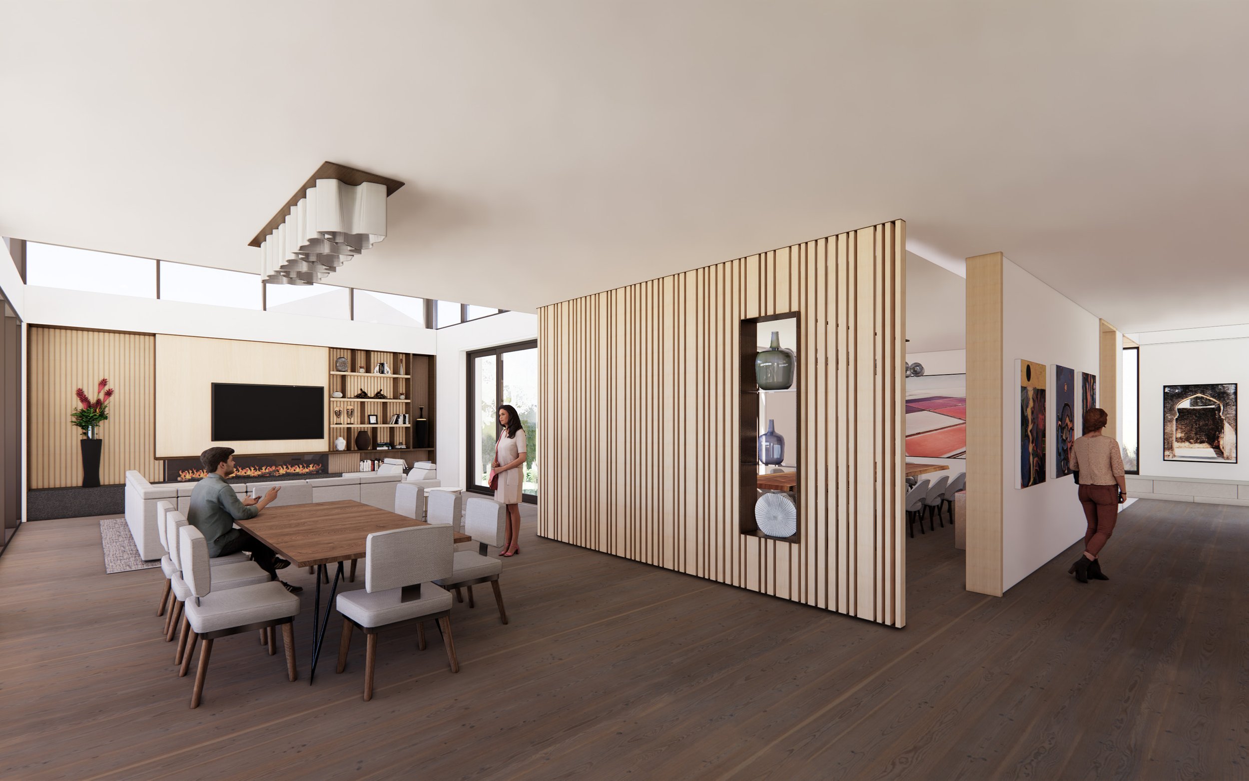 Modern open-concept living and dining area with wooden accents, a fireplace, and artwork on the walls, featuring three people, two women and one man.